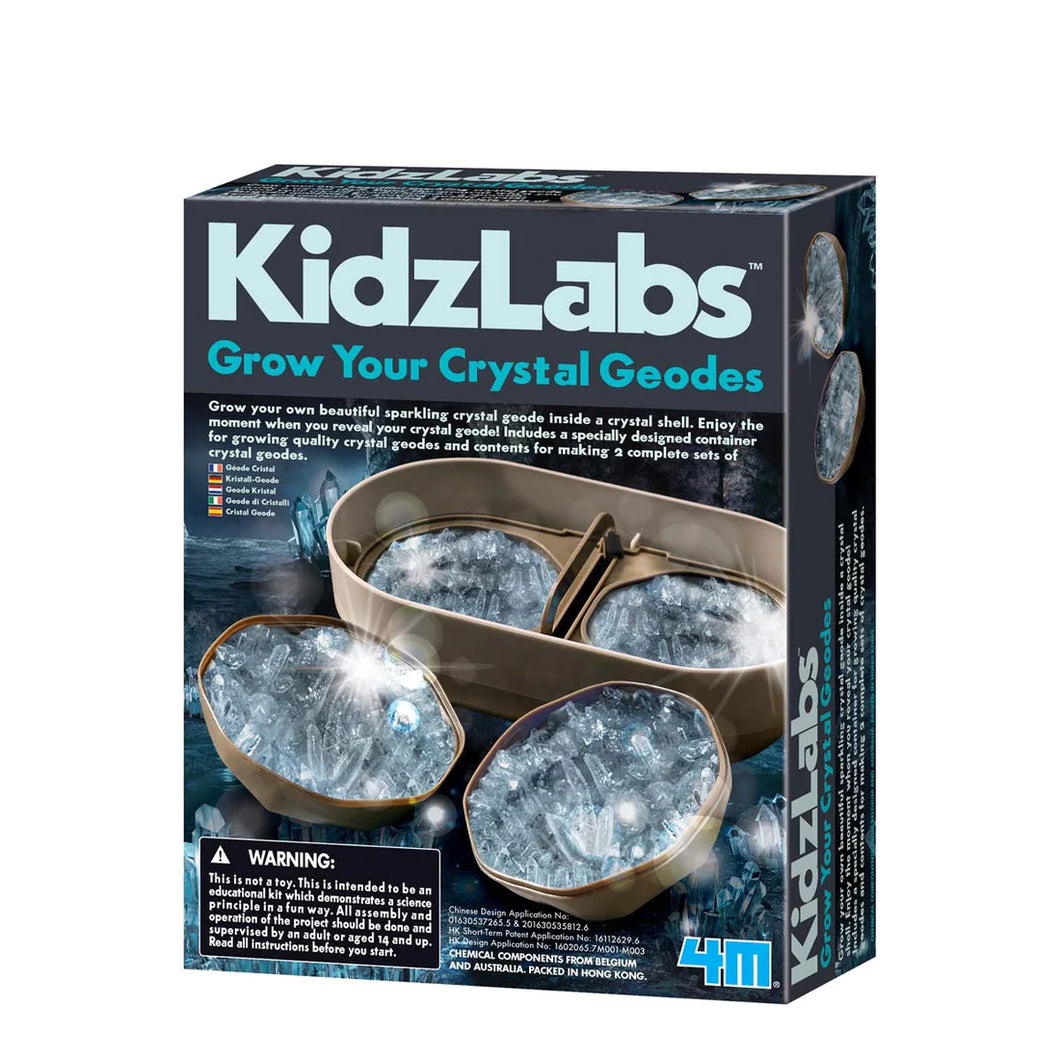Toysmith Crystal Geode Growing Kit with clear crystal geodes in case on black box on white background.