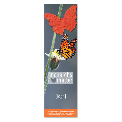 HALO long vertical blue Bookmark Seed Packet Save the Monarch Pollinator Pack with monarch butterfly on white flower with white text Monarchs Matter with orange Milkweed mix seed butterfly shaped pack against white background.